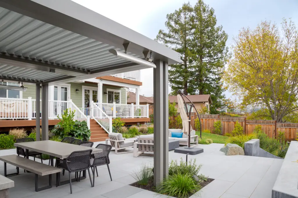 StruXure pergola beside a home's deck and staircase in Emerald Hills, CA