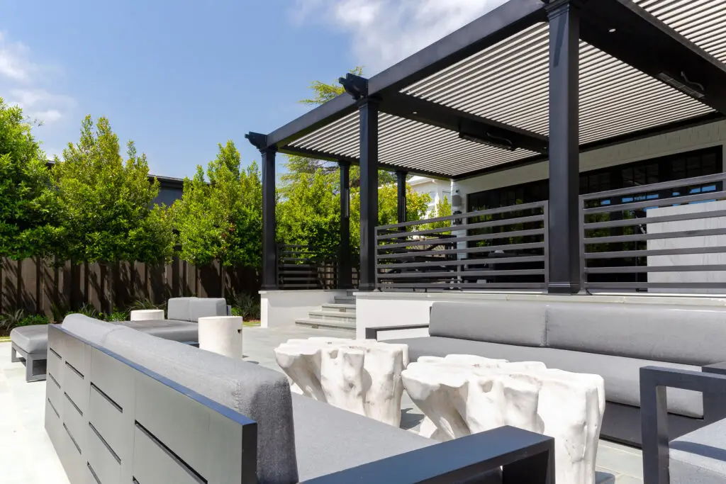 StruXure pergola with open louvers and integrated heater over lounge seating in San Mateo, CA