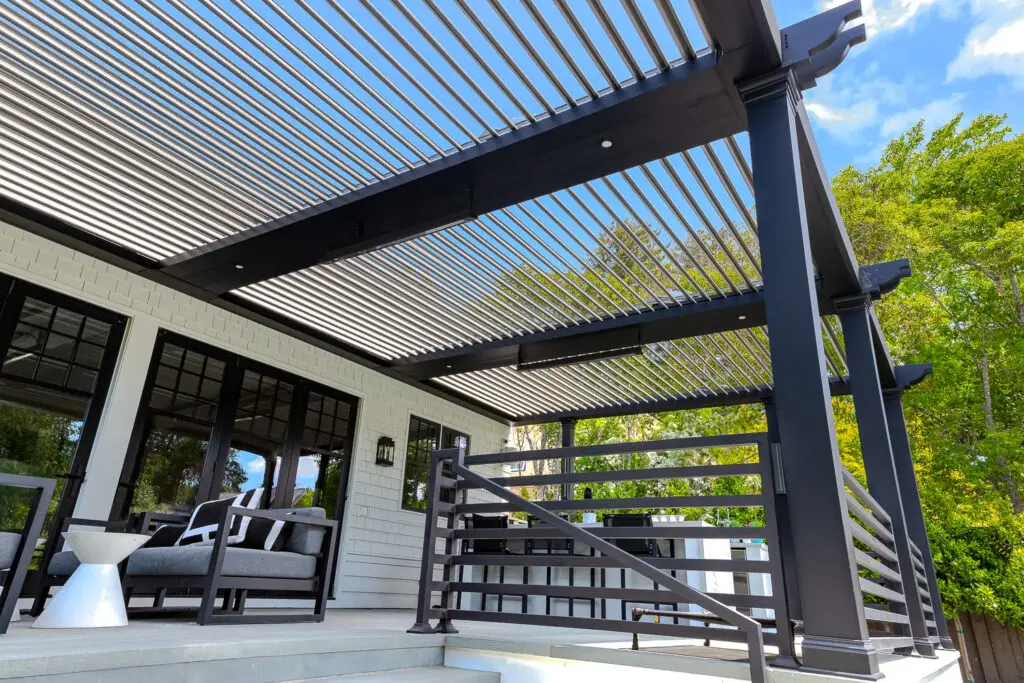 View up through open pergola louvers with an integrated infrared heater in San Mateo, CA