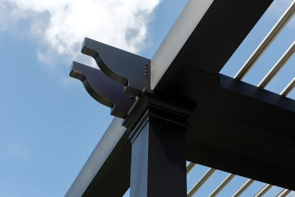 Close-up of a StruXure pergola's decorative corner bracket in San Mateo, CA