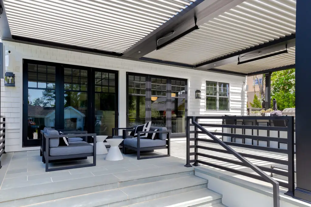 StruXure pergola patio alongside the home's black-framed glass doors in San Mateo, CA