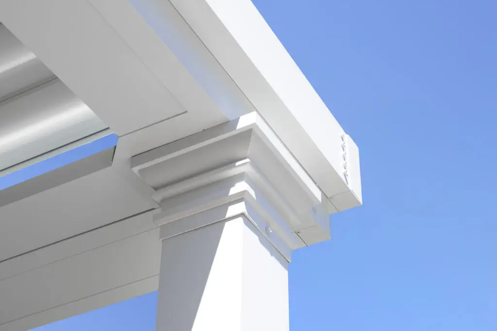 Close-up of a white pergola beam corner against a blue sky in Burlingame, CA