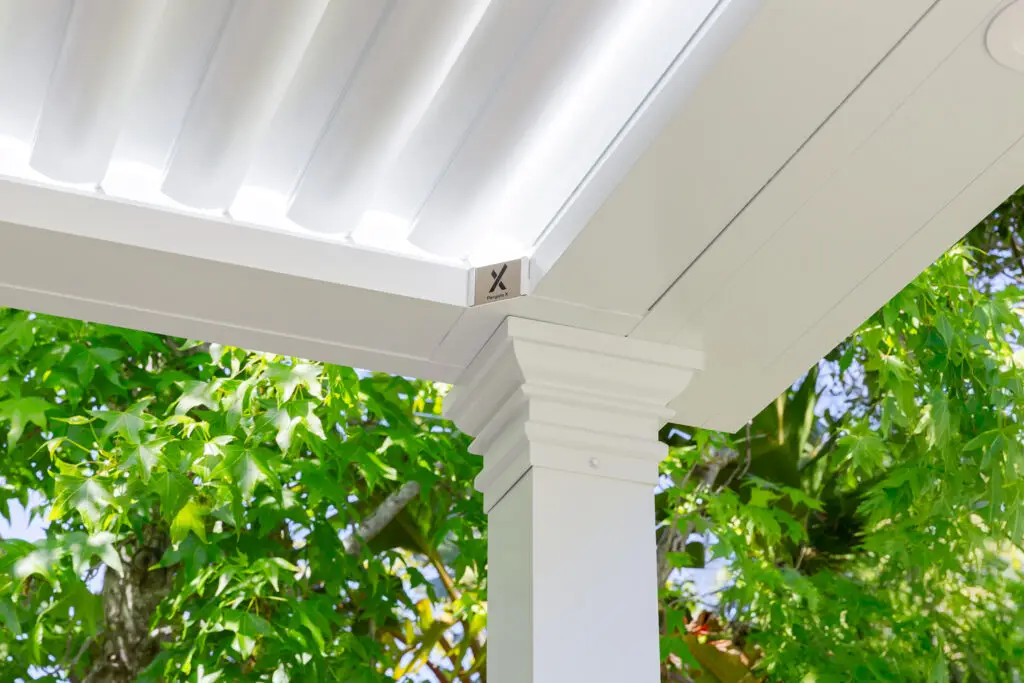 Close-up of a StruXure pergola corner post and beam with the logo badge in Burlingame, CA
